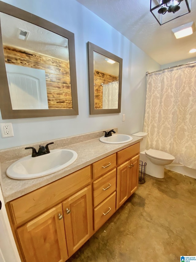 full bathroom with curtained shower, double vanity, toilet, and a sink