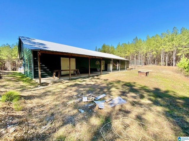 view of yard featuring an outbuilding and an exterior structure