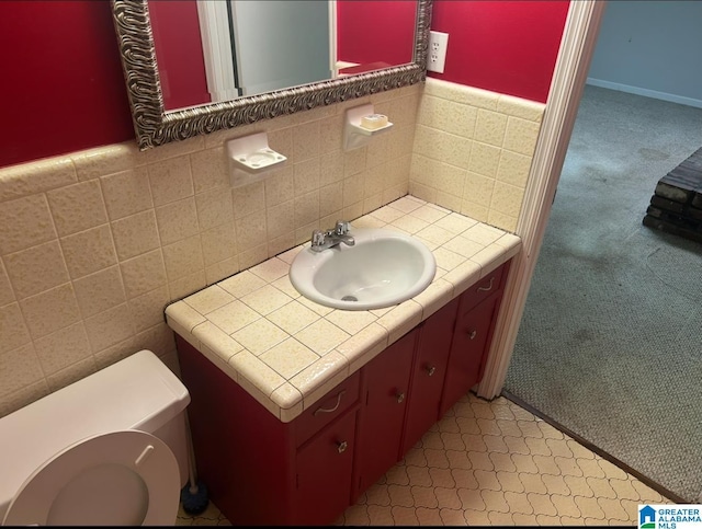 half bathroom with toilet and vanity