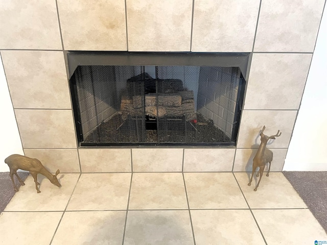 interior details with a tiled fireplace