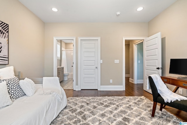 bedroom featuring recessed lighting, connected bathroom, baseboards, and wood finished floors