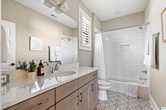 bathroom featuring visible vents, shower / bath combo with shower curtain, toilet, tile patterned flooring, and vanity