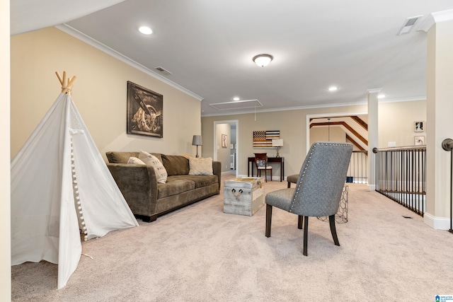 living room with visible vents, attic access, and carpet flooring