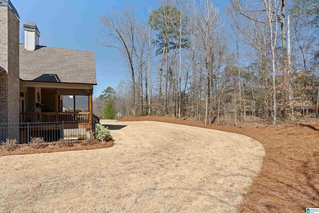 view of yard with covered porch