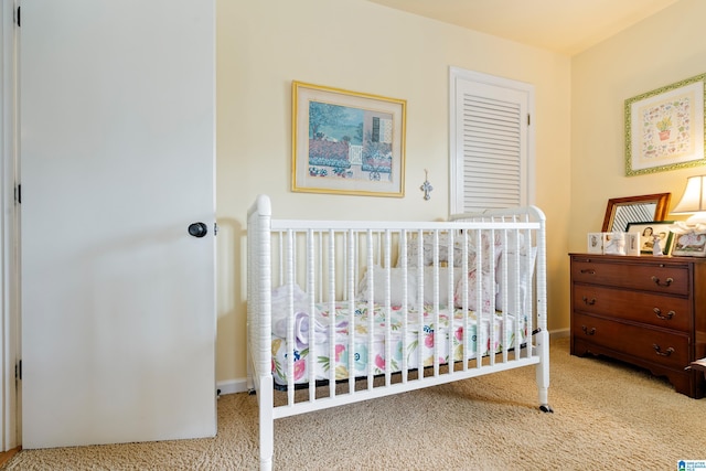 carpeted bedroom featuring baseboards