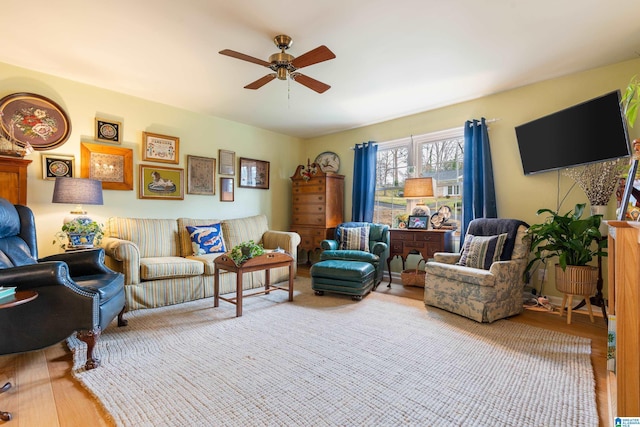 living area with ceiling fan