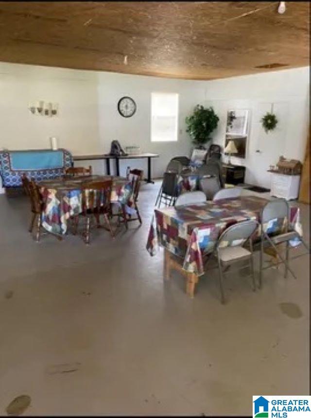 dining area with concrete flooring