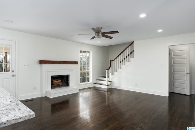 unfurnished living room featuring visible vents, dark wood finished floors, recessed lighting, baseboards, and stairs