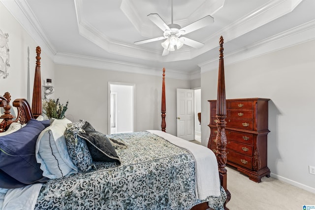 carpeted bedroom featuring baseboards, a raised ceiling, a ceiling fan, and ornamental molding