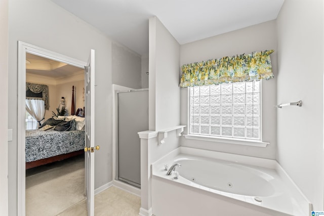 ensuite bathroom with a tub with jets, a stall shower, ensuite bathroom, and ornamental molding