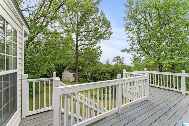 deck featuring a storage unit and an outdoor structure