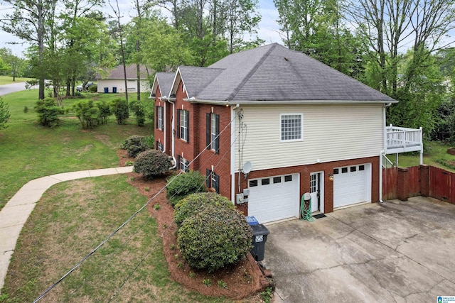 view of side of home with driveway, an attached garage, a shingled roof, a lawn, and brick siding