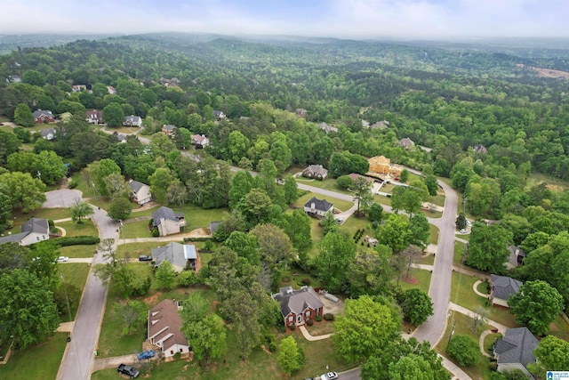 aerial view featuring a view of trees and a residential view