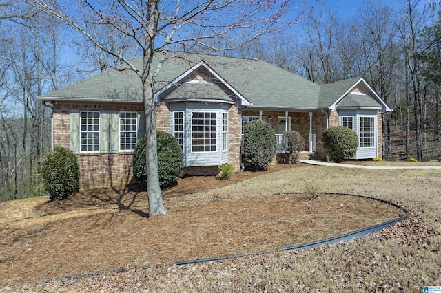 ranch-style home with brick siding and a porch