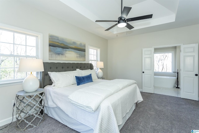 bedroom with ceiling fan, baseboards, and carpet floors