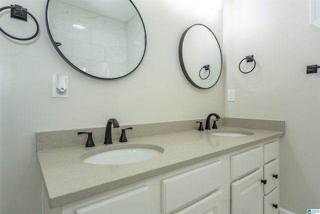 bathroom with double vanity and a sink