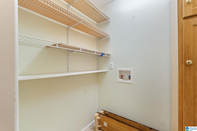 clothes washing area with hookup for a washing machine and laundry area