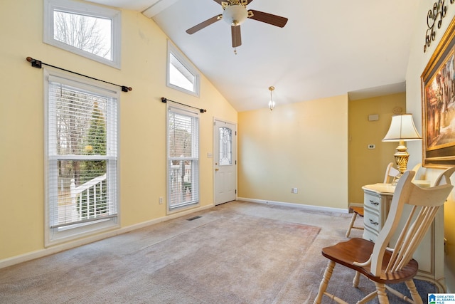 foyer entrance with a ceiling fan, baseboards, carpet floors, and high vaulted ceiling