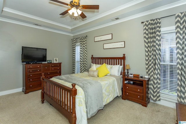 bedroom with visible vents, light carpet, multiple windows, and ornamental molding