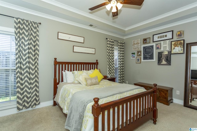 bedroom featuring visible vents, light carpet, crown molding, baseboards, and ceiling fan