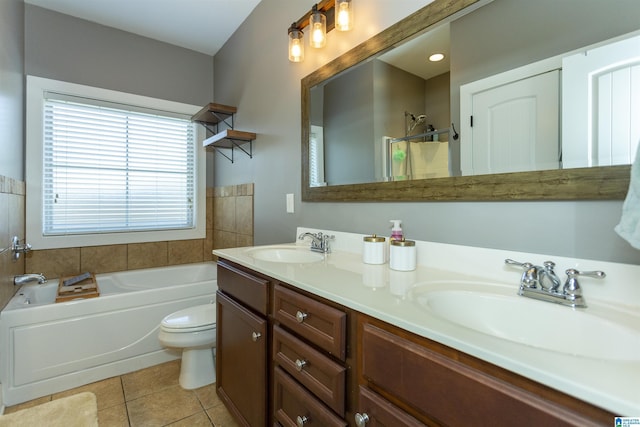 full bathroom with a bath, tile patterned flooring, toilet, and a sink