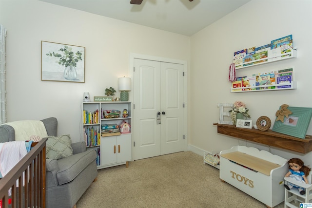 living area with ceiling fan and carpet floors