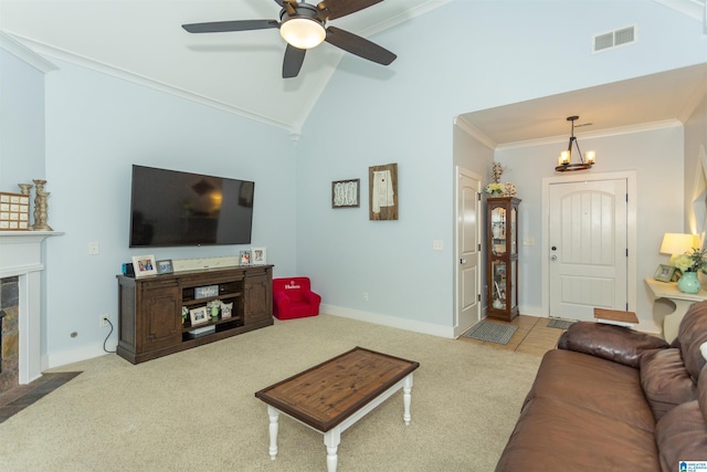 carpeted living area featuring baseboards, visible vents, high vaulted ceiling, a fireplace with flush hearth, and ornamental molding