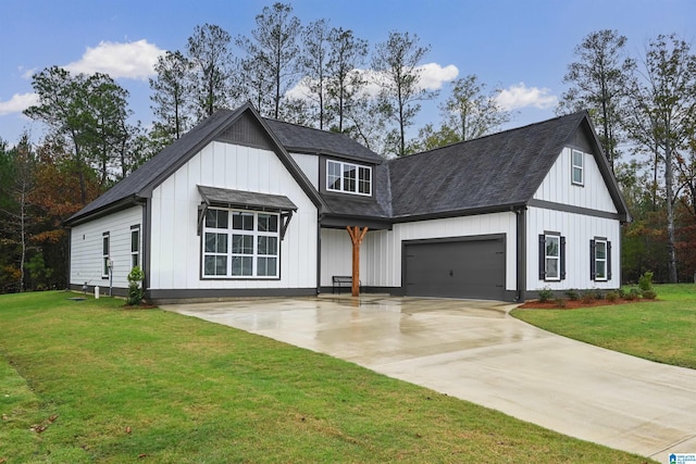 modern farmhouse style home featuring a front lawn, an attached garage, board and batten siding, and driveway