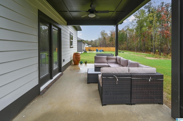 view of patio with an outdoor hangout area, a ceiling fan, and fence