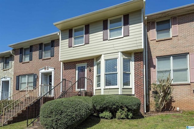 multi unit property featuring brick siding