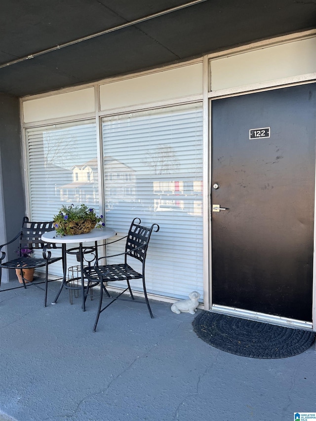 doorway to property with outdoor dining area