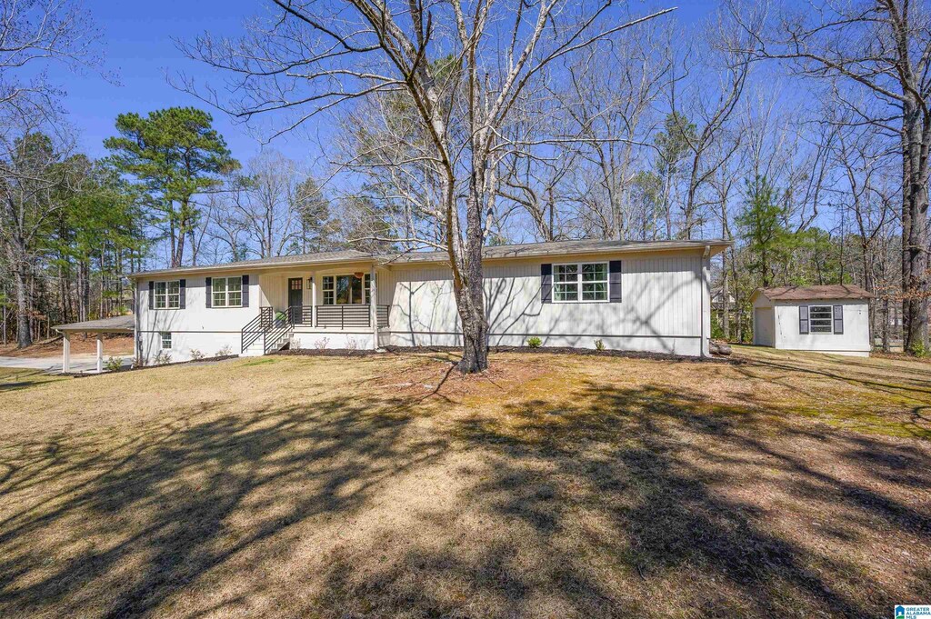 4916 Cahaba Valley Trce, Indian Springs Village, AL 35242 - single story home featuring a storage unit, an outdoor structure, and a front lawn