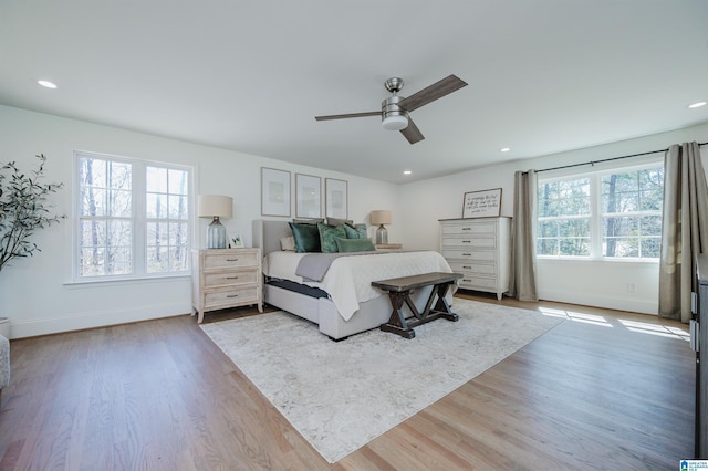 bedroom with recessed lighting, baseboards, wood finished floors, and ceiling fan