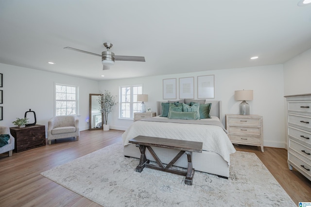 bedroom featuring recessed lighting, baseboards, wood finished floors, and a ceiling fan