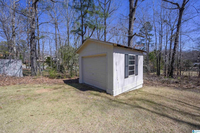 detached garage featuring driveway