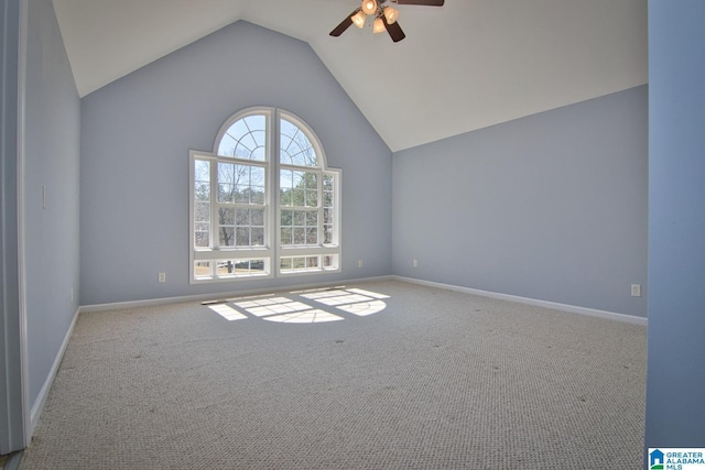 spare room with high vaulted ceiling, baseboards, carpet floors, and ceiling fan