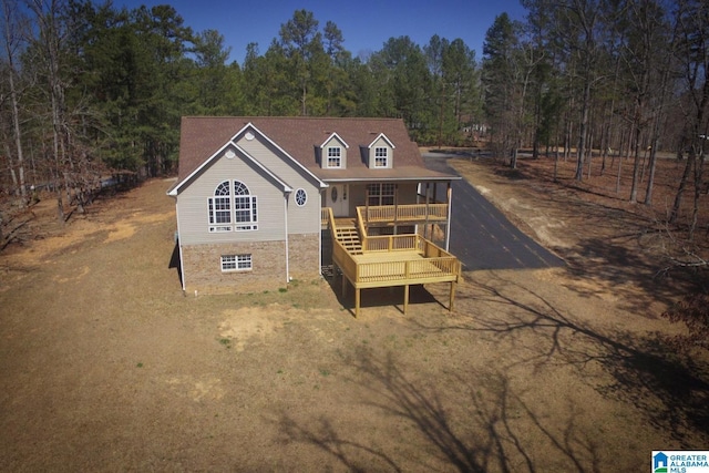 rear view of house with stone siding