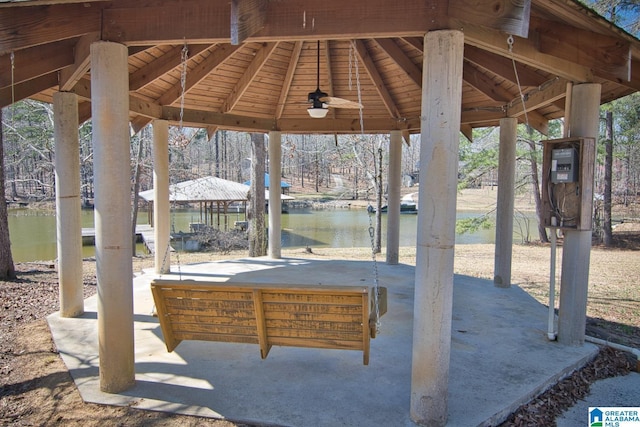 view of patio / terrace with a gazebo and a water view