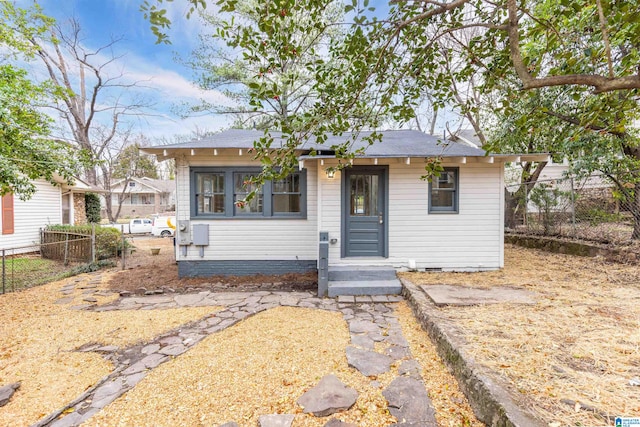 view of front of house with crawl space and fence