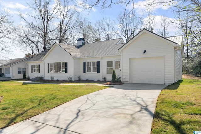 1808 2nd Ave N, Pell City, AL 35125 - single story home with metal roof, a front lawn, concrete driveway, and an attached garage