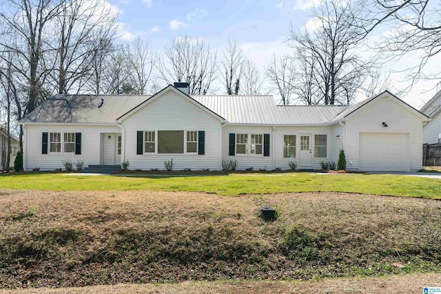 single story home with metal roof, a front yard, and a chimney