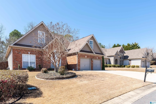 view of front of home with a garage, brick siding, and concrete driveway