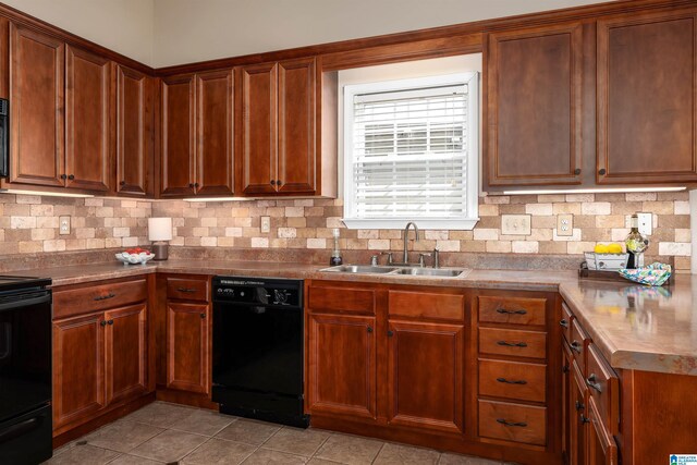 kitchen with dishwasher, range, backsplash, and a sink