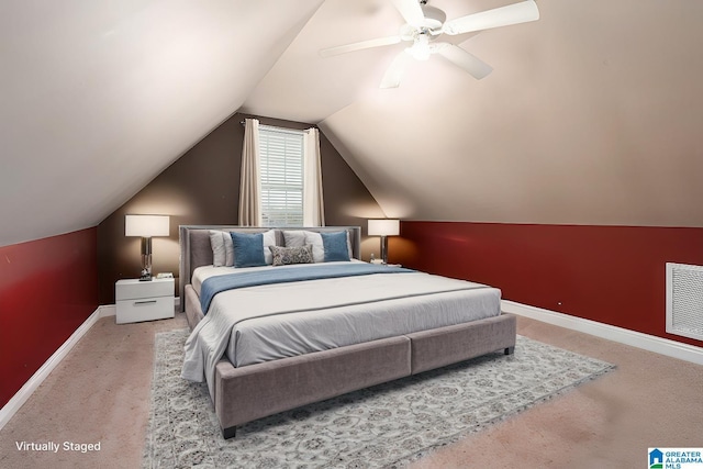 carpeted bedroom featuring visible vents, baseboards, lofted ceiling, and ceiling fan