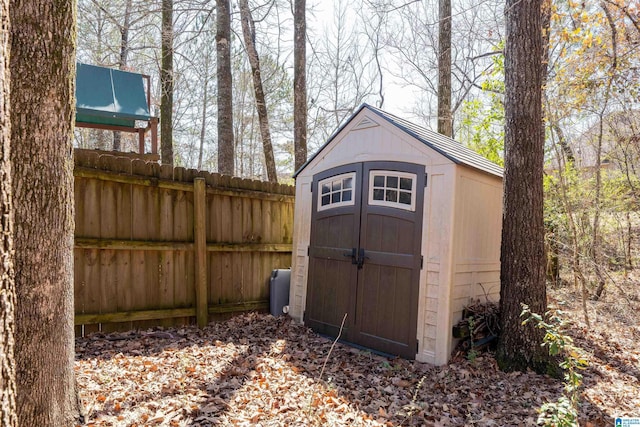 view of shed with fence