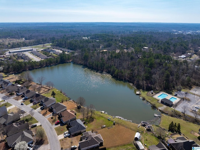 aerial view featuring a residential view, a view of trees, and a water view