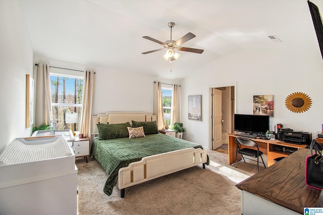 bedroom featuring vaulted ceiling, visible vents, light colored carpet, and multiple windows