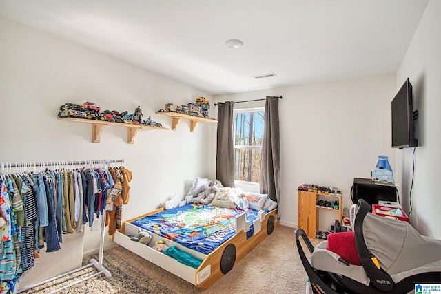 bedroom with visible vents, baseboards, and carpet flooring