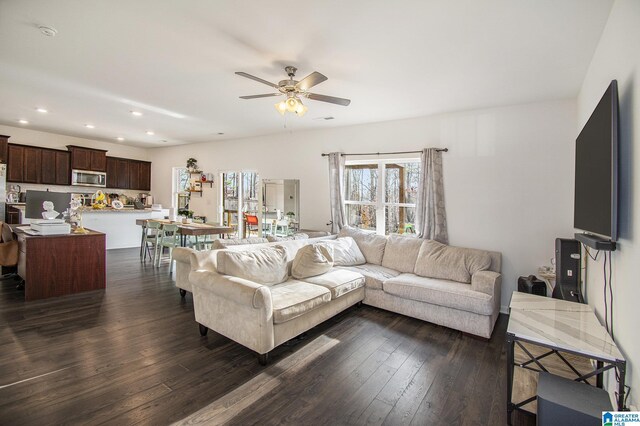 living area with recessed lighting, visible vents, dark wood finished floors, and a ceiling fan