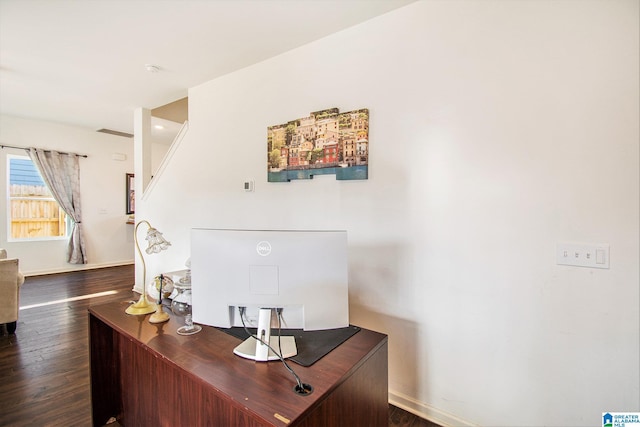 office area with baseboards and dark wood finished floors